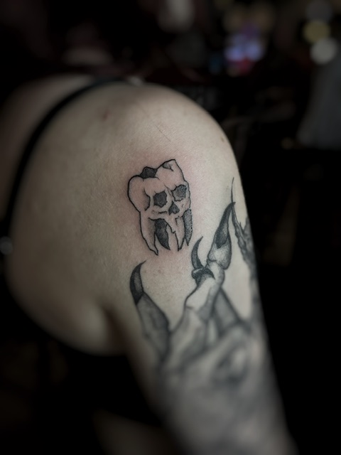 A skull tooth tattoo